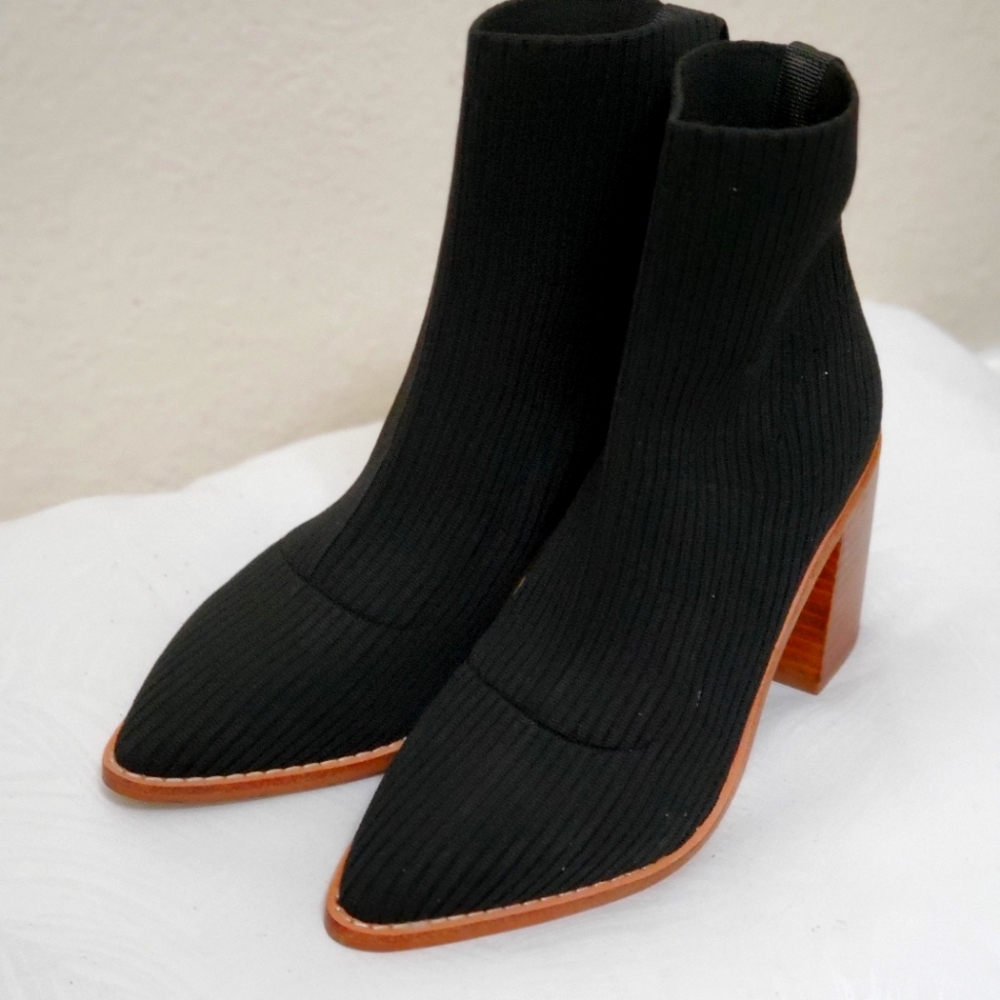 Black ankle booties by STEVEN with brown heels